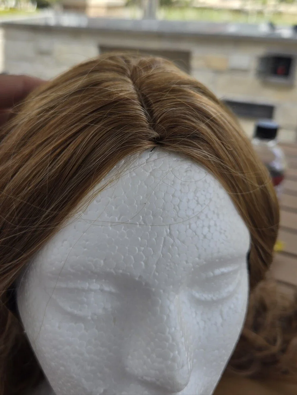 Women's long, wavy synthetic wig in a light brown/honey blonde Light Curls